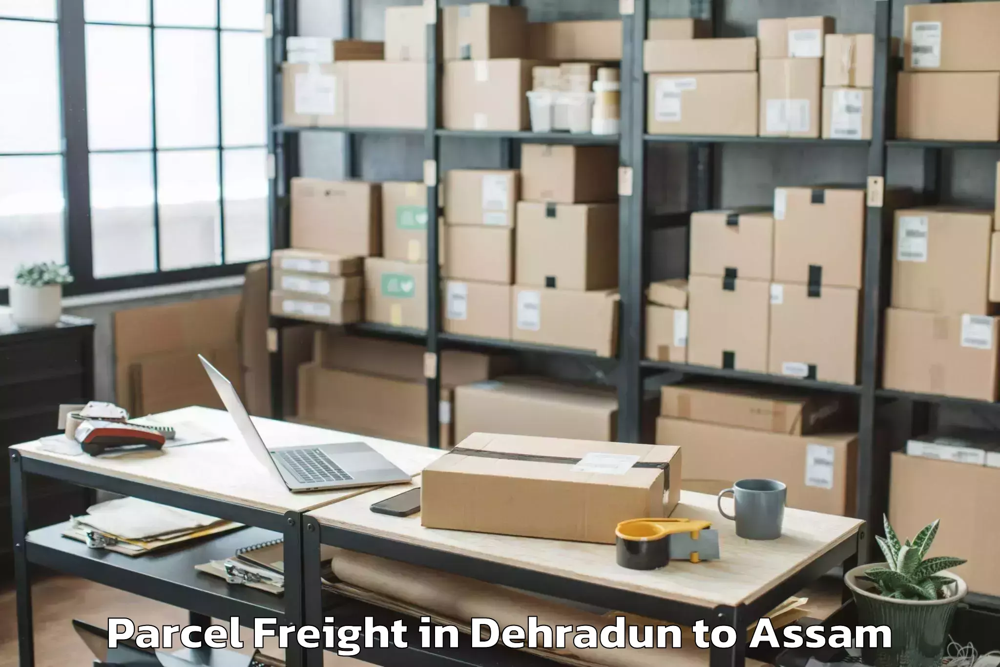 Reliable Dehradun to Raha Parcel Freight